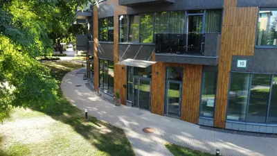 an overhead view of a building with glass windows at Park Apartments in Druskininkai