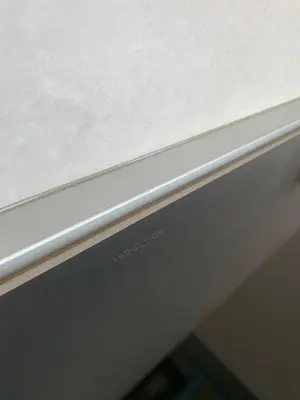 a close up of a white wall with a metal at Park Apartments in Druskininkai