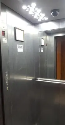 a metal elevator in a bathroom with a mirror at Cozy apartments in Druskininkai with panorama view in Druskininkai