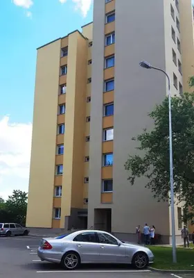 a silver car parked in front of a building at Cozy apartments in Druskininkai with panorama view in Druskininkai