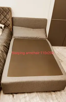 a bed frame with a mattress on a floor at HaPPy Inn Laime Studio, Self Check-In-24-7, A-C, Parking-in-the-underground-Garage in Vilnius