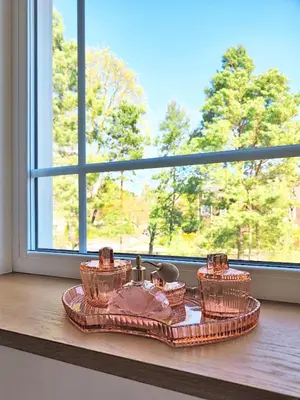 a tray with three dishes on a window sill at Suite with private bathroom at three bedroom interwar Villa Grabyte with daily spaces to share by pine forest on the bank of the river- 8min by car from old town in Kaunas