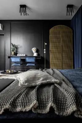 a bedroom with a large bed and a table at Berman House in Kaunas