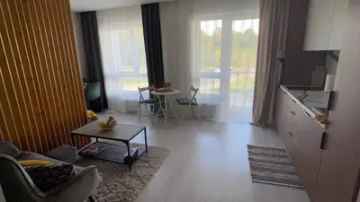 a living room with a couch and a table at Ozo flat in Vilnius