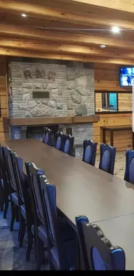 a conference room with a large table and chairs at Viesu vila Trakai ,su ežero pakrante in Meiluškės