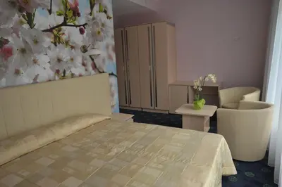 a bedroom with a bed and a flower wall at Mineral SPA Draugystė in Druskininkai