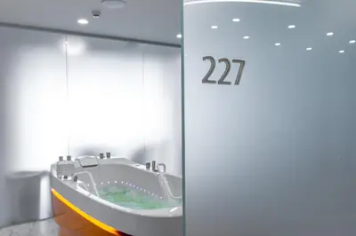 a bathroom with a bath tub in a room at Mineral SPA Draugystė in Druskininkai