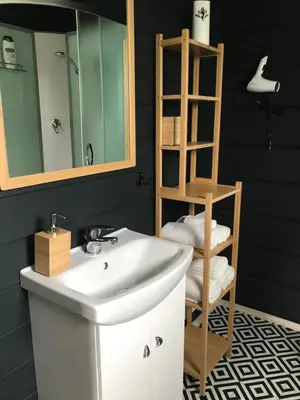 a bathroom with a white sink and a mirror at Atostogų namelis Laukys in Druskininkai