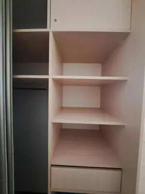 a cupboard with white shelves in a closet at Cozy place in Žirmūnai 2 in Vilnius