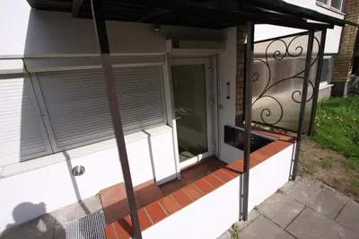 a front porch of a house with a gate at Cozy place in Žirmūnai 2 in Vilnius