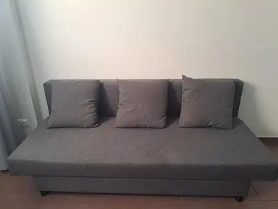 a bed with two pillows on it in a room at Cozy place in Žirmūnai 2 in Vilnius