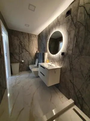a bathroom with a sink and a mirror at 2-bedrooms apartment in city center Šiauliai in Šiauliai