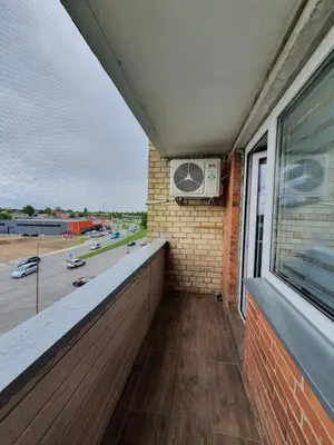 a balcony with a window and a air conditioner at 2-bedrooms apartment in city center Šiauliai in Šiauliai