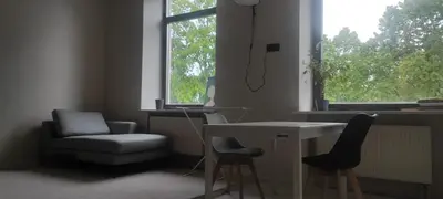 a room with a desk and a chair and a window at VEPA in Vepriai