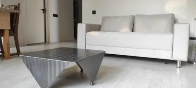 a living room with a white couch and a coffee table at VEPA in Vepriai