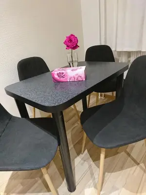 a black table with a pink bag on top at Link Kauno marių... in Kaunas