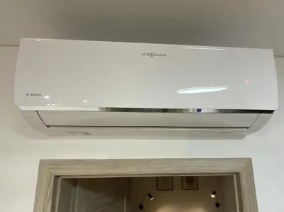 a white stove top oven in a room at Alėjos Apartmentai City in Druskininkai