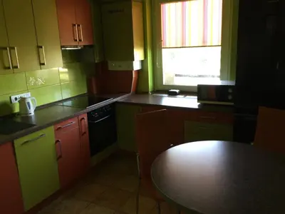 a small kitchen with a table and a tableablish at 2 Kambariu butas.Apartments-in the city UKMERGE. in Ukmergė