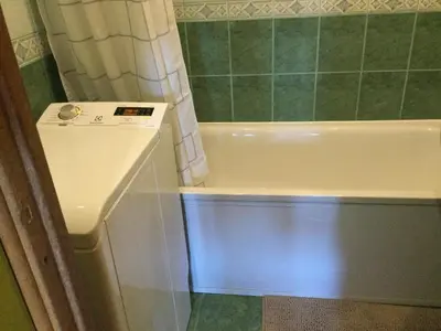 a bathroom with a sink and a bath tub at 2 Kambariu butas.Apartments-in the city UKMERGE. in Ukmergė