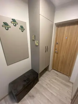 a hallway with a door and a stairwell with a door at ADI Apartamentai in Panevėžys