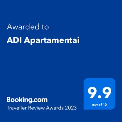 a blue sign with the text awarded to adhd apartmentarian at ADI Apartamentai in Panevėžys