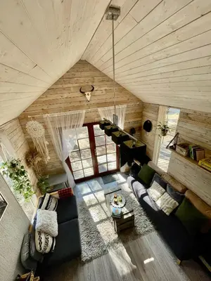 an overhead view of a living room in a house at Private cosy forest cabin in Inturkė