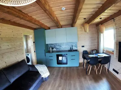 a living room with a couch and a table at Chill House in Miežonys