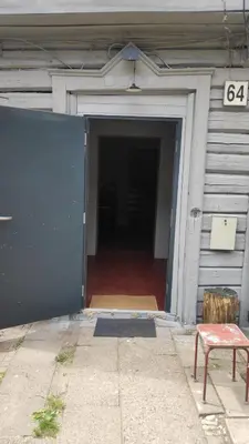 an open door of a garage with a door at Shanghai Banzai Family Apartment Vilnius in Vilnius