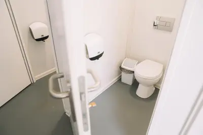 a bathroom with a toilet and a sink at Natur Camp Glamping Birštonas in Birštonas