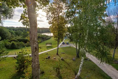 a view of a park with trees and a road at Namelis ant ežero kranto 