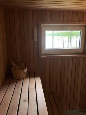 a small room with a window and a wooden floor at 5 Nameliai in Kudariškės
