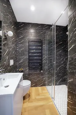 a bathroom with a toilet and a glass shower at Exclusive OldNew apartments in city center in Panevėžys