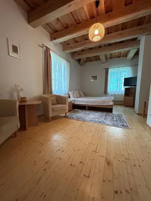 a living room with a couch and a table at In heart of Trakai you'll find authentic Karaim house in Trakai