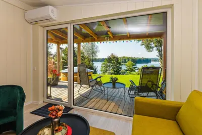 a living room with a large sliding glass door at Volunge house in Doškonys