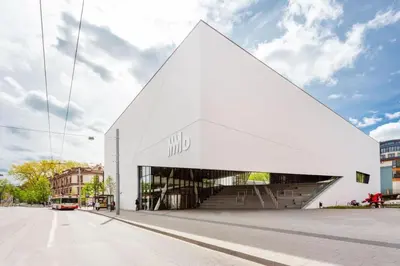 a large white building with the word who on it at Cozy Suite with Inner Yard in Vilnius