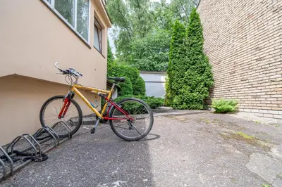 two bikes are parked next to a building at Cozy Suite with Inner Yard in Vilnius