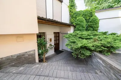 a walkway leading to the front door of a house at Cozy Suite with Inner Yard in Vilnius