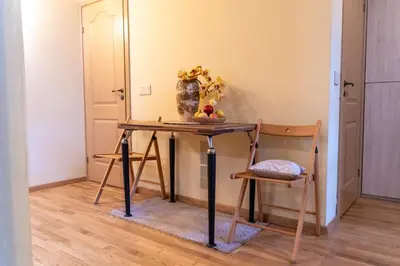 a dressing table with a mirror and a chair at Cozy Suite with Inner Yard in Vilnius