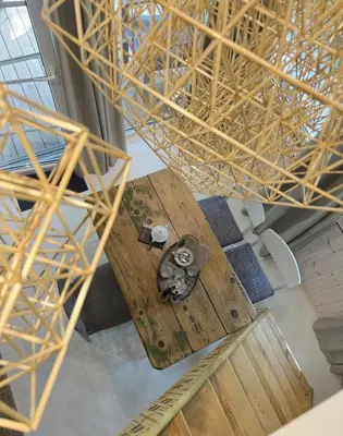 an overhead view of a wooden table in a room at ALNUS KIEMAS in Kampiškiai