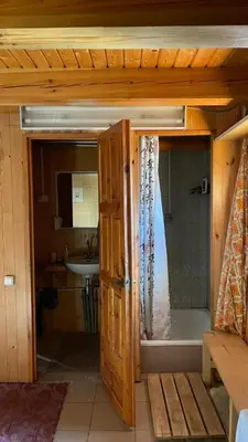 a bathroom with a shower and a sink at Saulėtekio 12 in Ignalina