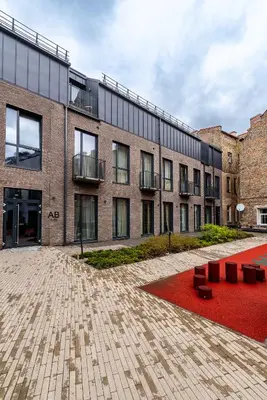 a building with a red carpet in front of it at Vilnius Old Town Renaissance Studio 2 in Vilnius