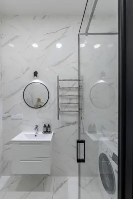 a white bathroom with two sinks and a shower at Vilnius Old Town Renaissance Studio 2 in Vilnius