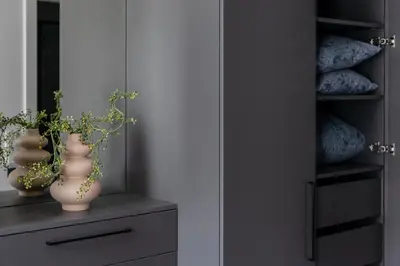 two vases sitting on a shelf in a closet at Vilnius Old Town Renessainse Studio 3 in Vilnius