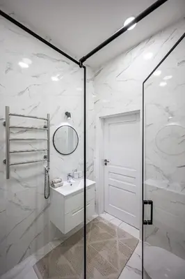 a white bathroom with a shower and a sink at Vilnius Old Town Renessainse Studio 4 in Vilnius