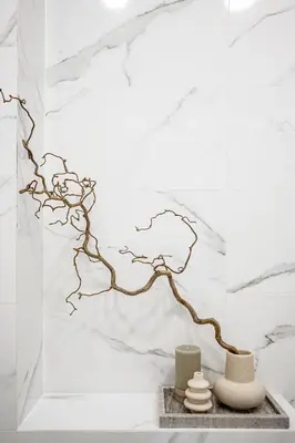 a sculpture of a branch on a white wall at Vilnius Old Town Renessainse Studio 4 in Vilnius
