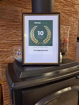 a framed picture sitting on top of a table at LIUX apartamentai in Kaunas