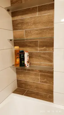 a bathroom with a wooden wall with some food at HaPPy Inn Egle, Self Check-In-24-7, A-C, Parking-in-the-underground-Garage in Vilnius