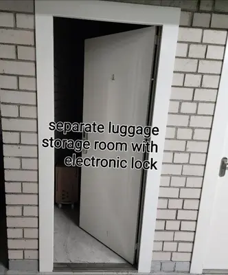 an open door with the words separate language storage room with electronic lock at HaPPy Inn Egle, Self Check-In-24-7, A-C, Parking-in-the-underground-Garage in Vilnius