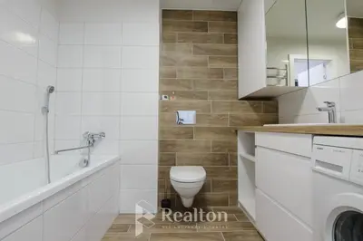 a bathroom with a toilet and a shower and a sink at HaPPy Inn Egle, Self Check-In-24-7, A-C, Parking-in-the-underground-Garage in Vilnius