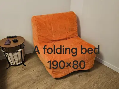 ainding bed sitting in the corner of a room at HaPPy Inn Egle, Self Check-In-24-7, A-C, Parking-in-the-underground-Garage in Vilnius